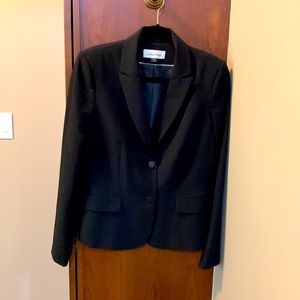 Calvin Klein size 8 black suit. Pants are slim fit and ankle length.